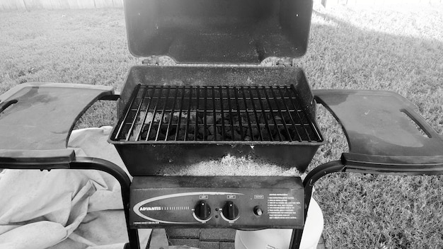 Close-up shot of various types of grills: charcoal, gas, and pellet. Each grill is labeled clearly, highlighting their key features and benefits. The focus is on showcasing their design and functionality.