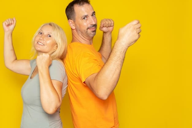 A husband pointing to something exciting at a sports game, and his wife is smiling big with equal excitement.