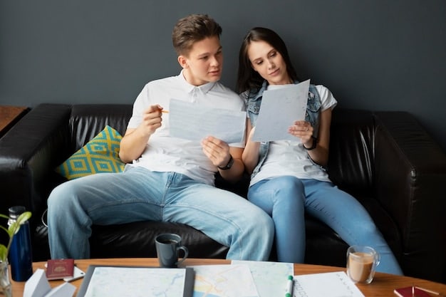 A couple sitting on a couch, facing each other, having a serious but calm discussion. They are holding hands, and there are financial documents spread out on the coffee table in front of them.