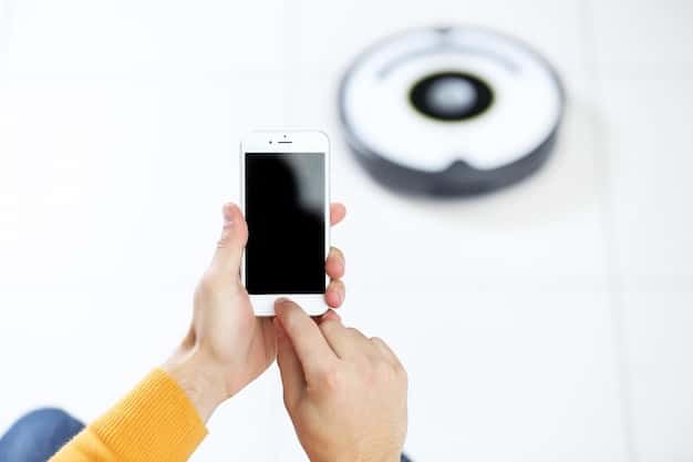 A close-up of a smartphone displaying a live security camera feed, with a notification about potential motion detected. The interface is clean and user-friendly, emphasizing the accessibility and control offered by smart home security systems.