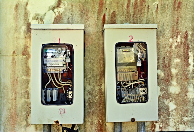 An electrical panel with a mix of old and new wiring, illustrating an outdated and potentially unsafe system.