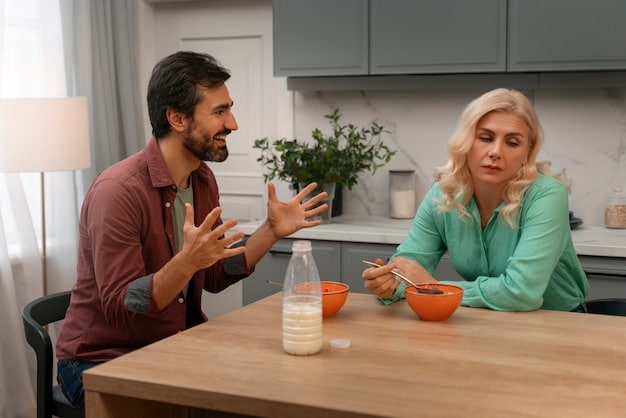 A couple sitting across from each other at a kitchen table, deep in conversation, with notebooks and pens, symbolizing intentional communication and planning. Warm, inviting lighting suggests a safe space.