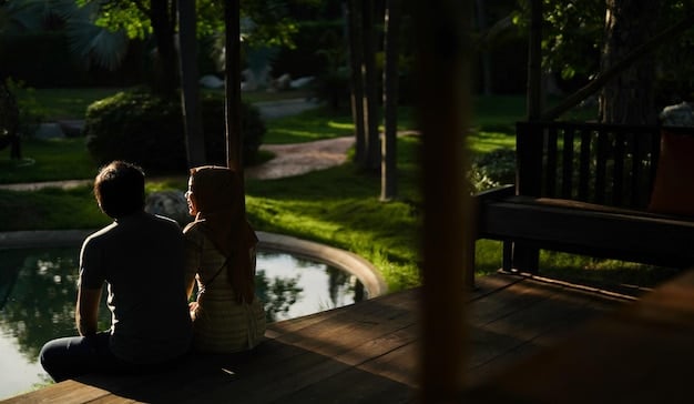 A couple sitting back-to-back, symbolizing a moment of reflection or disagreement, with subtle rays of light suggesting hope and resolution.