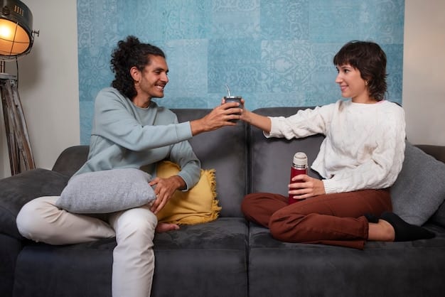A couple sitting on a sofa, facing each other with gentle smiles, engaged in quiet conversation, holding hands in a sunlit living room, symbolizing deep communication.