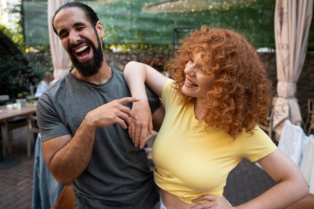 A couple laughing together, leaning into each other, reflecting joy and deep connection achieved through effective communication. The focus is on their genuine smiles and relaxed embrace.