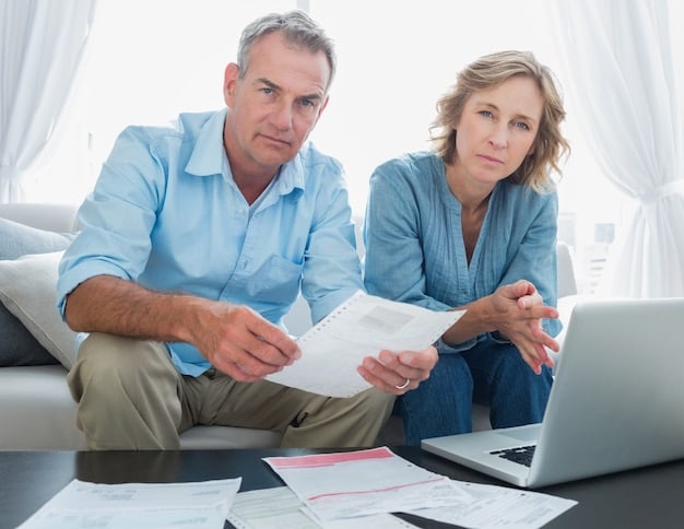 A couple sitting with a financial advisor, reviewing papers and nodding, implying collaborative financial planning for their future.