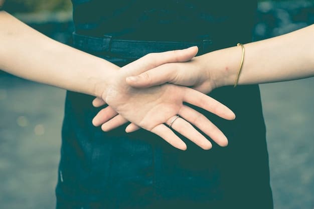 Two hands gently coming together, symbolizing reconciliation, trust, and connection after conflict. The background is blurred, focusing on the comforting gesture.
