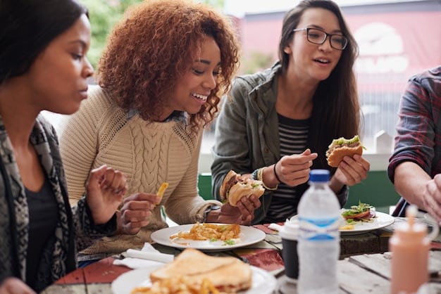 A diverse group of friends sharing a meal outdoors, laughing and enjoying their company, emphasizing collective well-being.
