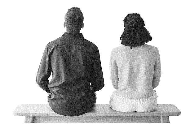 Two people are sitting back-to-back, separated by a subtle, almost invisible barrier, symbolizing emotional distance in intimacy caused by unresolved issues.