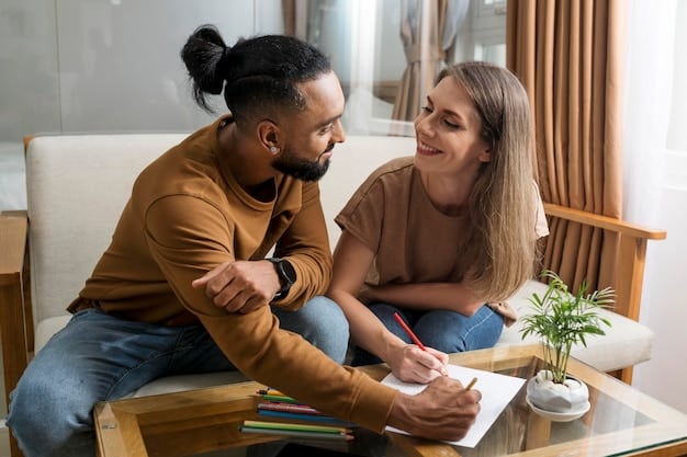 A diverse US couple sits face-to-face, each holding a notepad, actively listening to one another in a calm setting, symbolizing empathetic communication during a financial discussion.