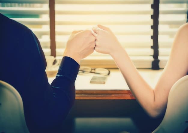 A close-up shot of two hands, one male and one female, interlocking fingers over a shared financial planner or notebook, symbolizing collaboration and unity.