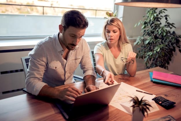 A US couple sits with a financial advisor in a bright office, reviewing documents and discussing investment strategies, with an open laptop showing graphs and charts.