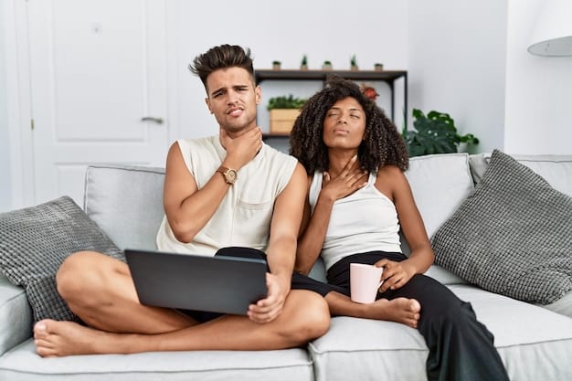 A US couple comfortably seated on a sofa in their living room, having an unhurried, calm conversation, with a financial notebook and tea on the coffee table between them, symbolizing a safe and relaxed environment for financial discussions.