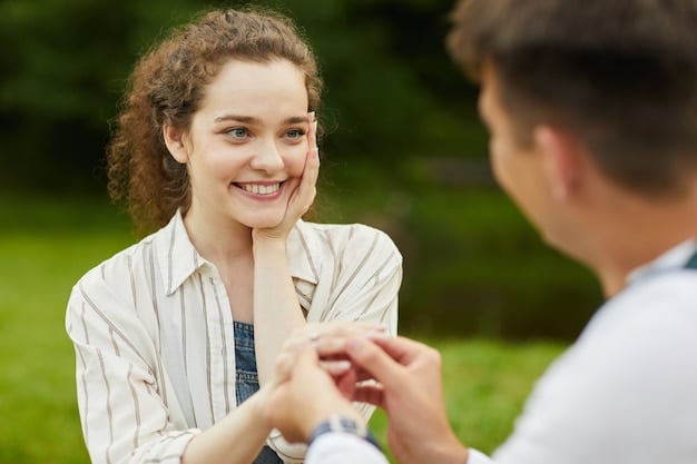 Two people smiling and holding hands after a conversation, looking relieved and connected, with a peaceful, natural background.